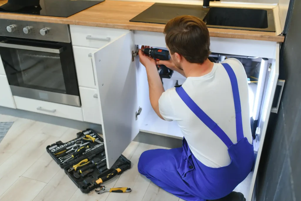 Thorough handyman conducting detailed home maintenance inspection with checklist and tools in Dubai residential property identifying potential issues and repairs needed