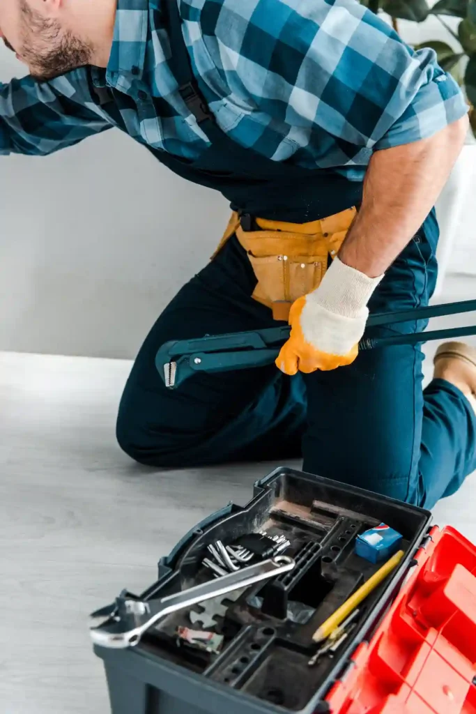 Skilled and experienced handyman performing comprehensive home repairs and maintenance work in modern Dubai residence with professional tools and equipment