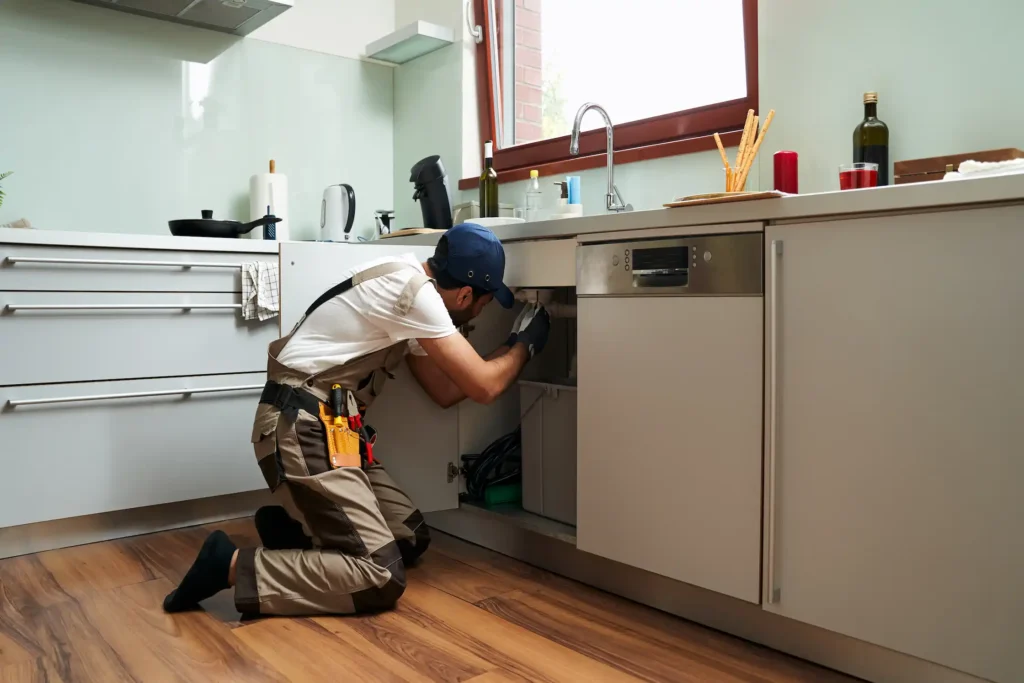 Expert plumber clearing and repairing main sewer line blockage in Dubai property using hydro-jetting equipment and modern techniques for effective cleaning