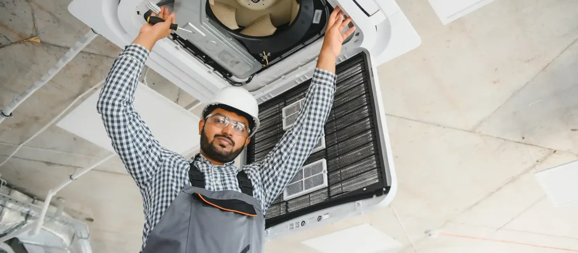 Expert technician repairing AC compressor unit during maintenance in Dubai using diagnostic tools to fix cooling issues and restore proper system functionality