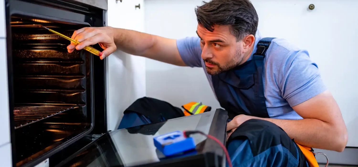 DEWA certified and licensed electrician performing comprehensive electrical safety inspection with testing equipment in modern Dubai home ensuring compliance with regulations