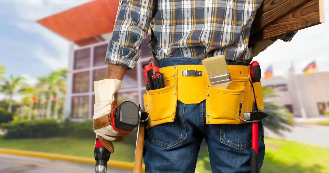 Professional handyman assembling IKEA flat-pack furniture with expert precision in spacious Dubai apartment living room using specialized assembly tools and equipment