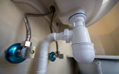 Professional plumber replacing damaged water pipe with new copper piping in Dubai property using welding tools ensuring leak-free connections and durability