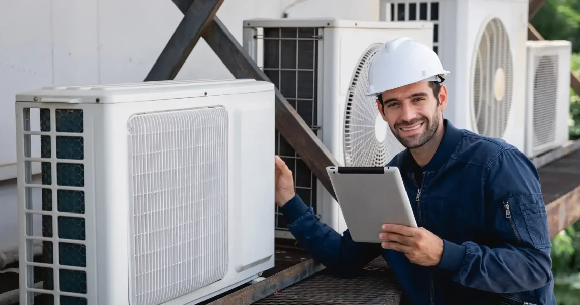 Professional technicians installing new split AC unit on wall in Dubai apartment with proper positioning and secure mounting ensuring efficient cooling distribution
