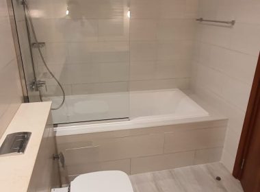 Complete Washroom with Wall Tiling, Glass Partition, Bath Tub & Vanity Installation